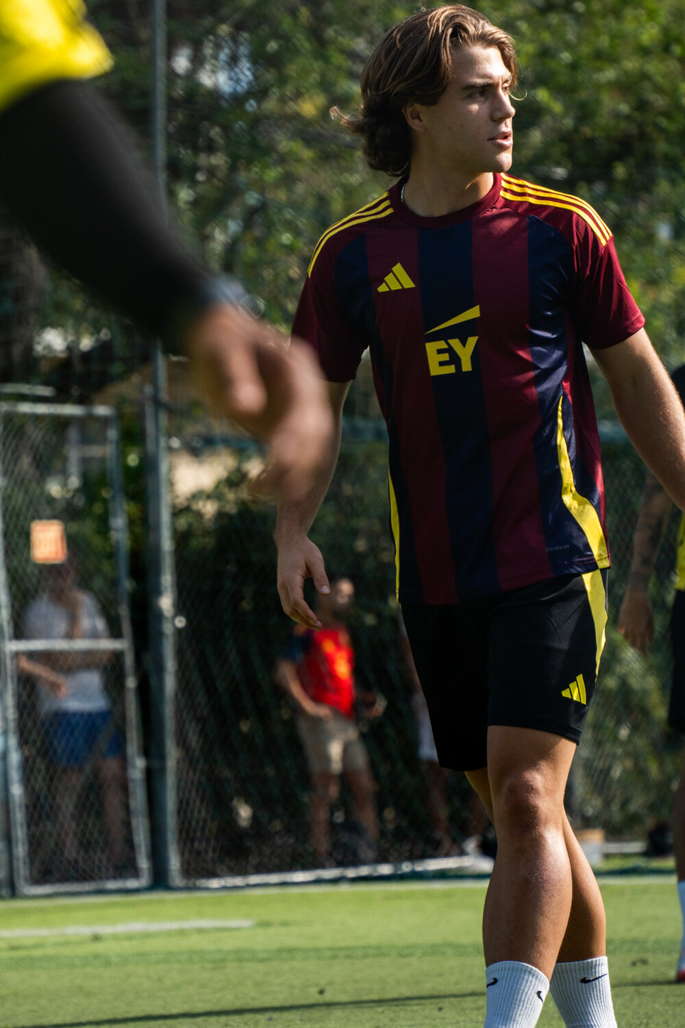 EY captain in custom striped kit